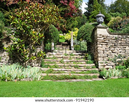 Tranquil Landscape Garden Scene of a Freshly Mown Lawn and Steps to an Upper Level