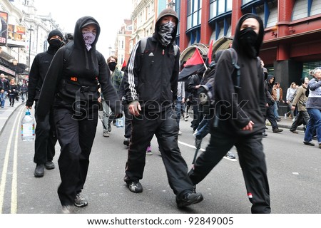 LONDON - MARCH 26: A breakaway group protesters march through the streets of the British capital during a large austerity rally on March 26, 2011 in London, UK.