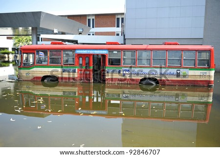 BANGKOK - NOV 18: A flooded bus in the grounds of Don Mueang International Airport, which is closed due to the severe flooding on Nov 18, 2011 in Bangkok, Thailand.