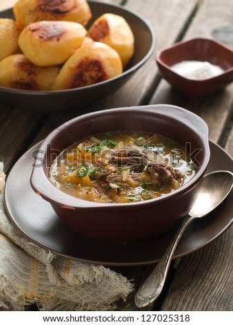 A bowl of vegetable soup with sour cabbage, selective focus