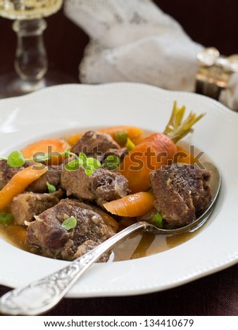 Game meat ragout with carrot, selective focus