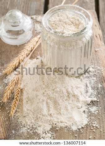 Vintage bank with whole wheat flour, selective focus