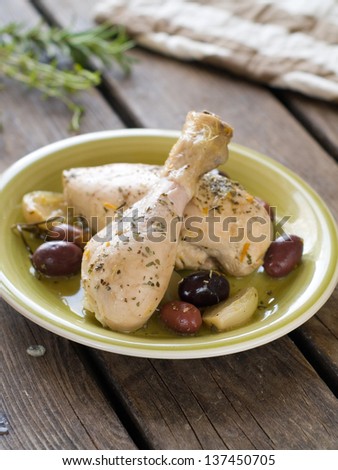Stewed chicken leg with olive and onion, selective focus
