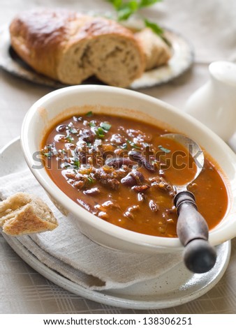A bowl of homemade chili bean soup with meat, selective focus