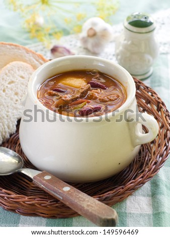 A bowl of homemade chili bean soup with meat, selective focus