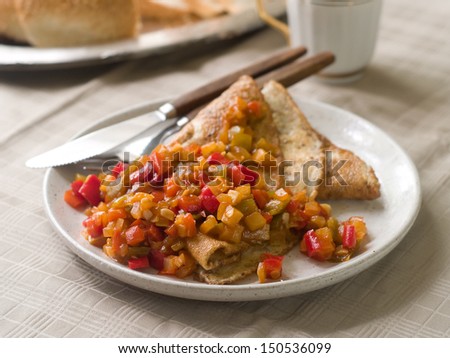 Omelette with vegetable sauce, selective focus