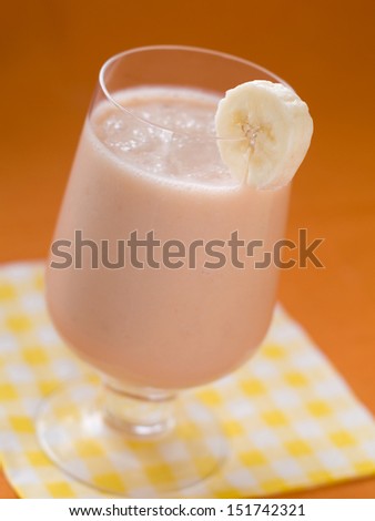 Milk shake with banana, selective focus