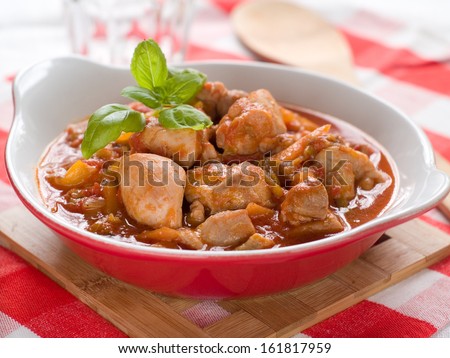 Provencal chicken stew with pepper ant tomato, selective focus