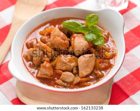 Provencal chicken stew with pepper ant tomato, selective focus