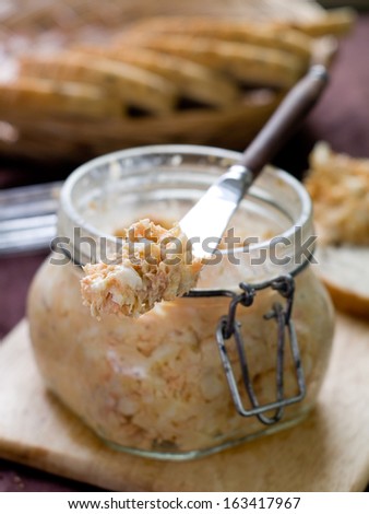 Fish, soft cheese and egg pate in glass jar, selective focus