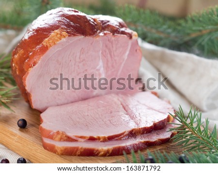 Smoked meat on wooden board, selective focus