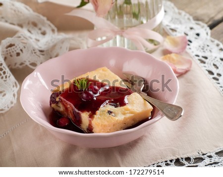 Cottage cheese cake with berry sauce, vintage style, selective focus