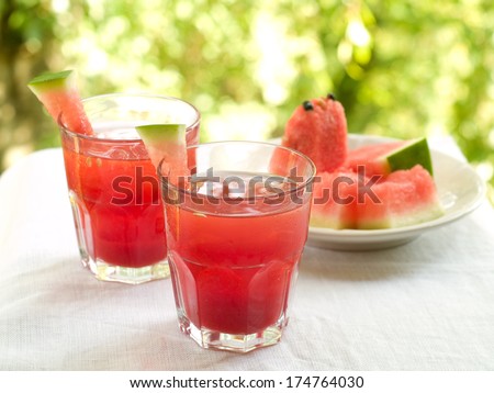 Watermelon lemonade with ice cube, selective focus
