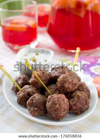 Minced meat ball with sauce on plate, selective focus