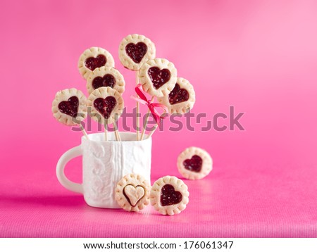 Cookie pop decorated with heart, selective focus