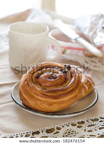 Sweet bun with cinnamon and sugar, selective focus