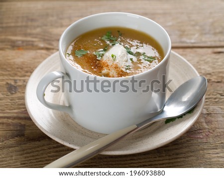 Delicious and creamy vegetable soup in cup, selective focus