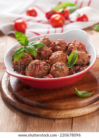 Minced meat ball in tomato sauce, selective focus