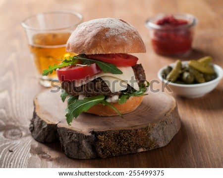 Homemade hamburger with fresh tomatoes, selective focus