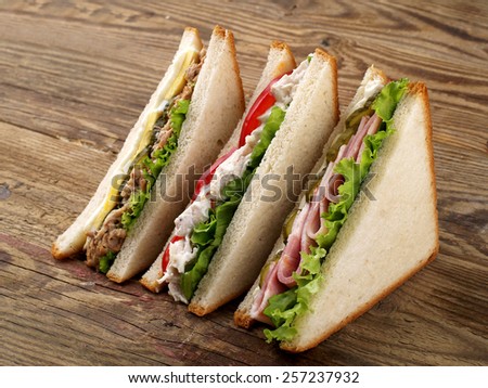 Club sandwiches with tuna, ham and chicken, selective focus