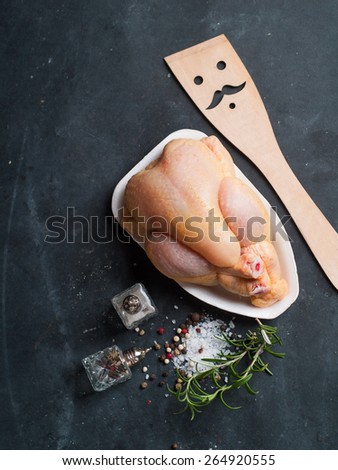 Fresh chicken on dark vintage background, selective focus. Healthy food, diet or cooking concept