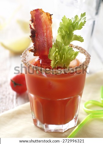 Bloody mary cocktail with bacon and celery, selective focus