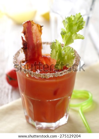 Bloody mary cocktail with bacon and celery, selective focus