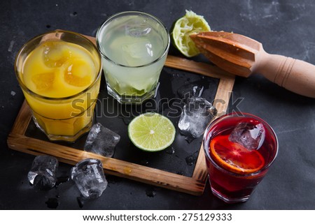 Different fresh cocktail on wooden background, selective focus