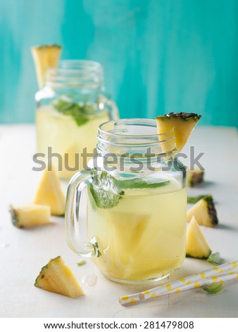 Pineapple lemonade with lemon and mint, selective focus