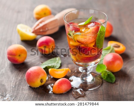 Summer drink with apricot ( or peach)  in glass, selective focus