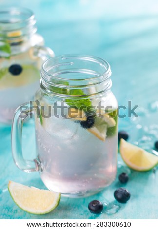 Citrus lemonade with blueberry and mint, selective focus
