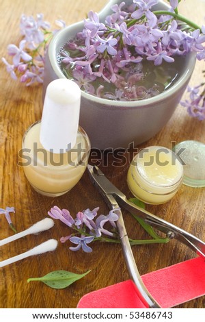 Device for manicure. Lilac on background. Could be a generic toiletry.