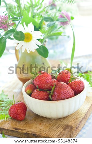 Fresh strawberries in a ceramic  bowl