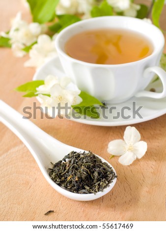 Organic jasmine tea with fresh jasmine flowers.