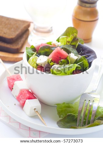 Salad from watermelon, lettuce and feta in cup