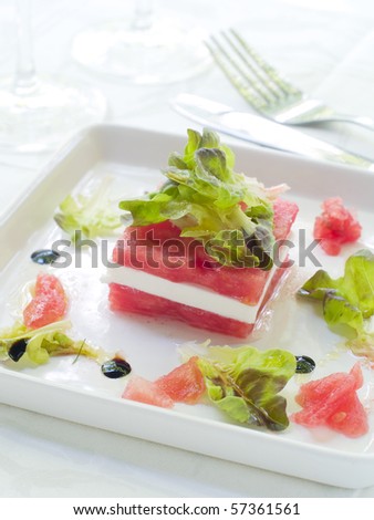 Appetizer from lettuce, watermelon and feta in cup