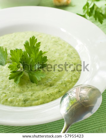 Delicious vegetable soup with potato, broccoli, green beans and parsley