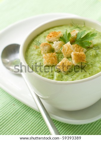 Delicious vegetable soup with potato, broccoli, green beans and parsley