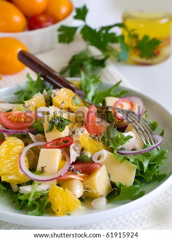 Fresh garden salad with a fork  on plate