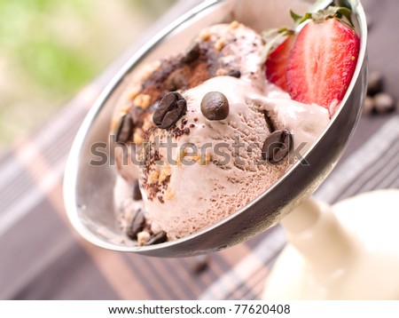 Chocolate ice cream with coffee bean and strawberry