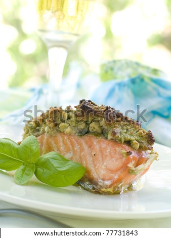 A grilled salmon fillet with grilled eggplant and wine. Shallow depth, selective focus