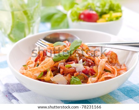 Tagliatelle pasta with tomato and vegetable sauce