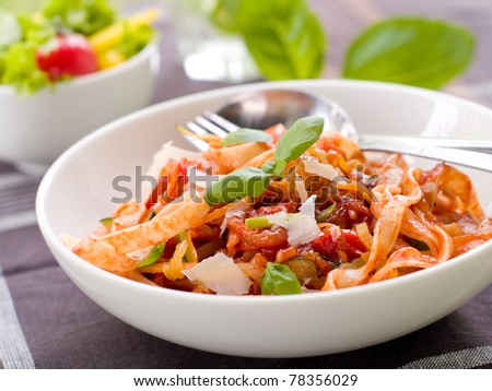 Tagliatelle pasta with tomato and vegetable sauce. Selective focus