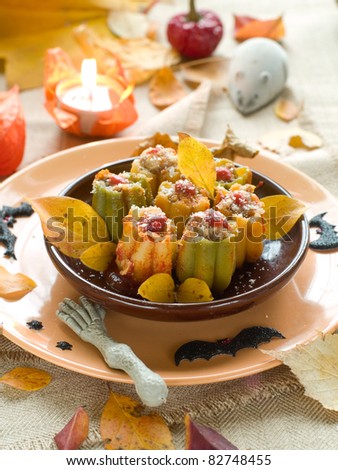 Pumpkin pasta stuffed with rikotta and minced meat for Halloween party. Selective focus