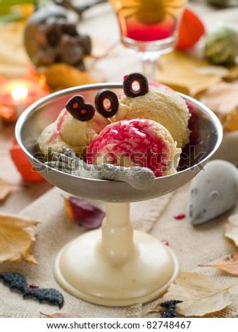 Pumpkin-apple ice - cream with bloody sauce for Halloween party. Selective focus