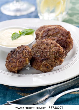 Minced meat ball with sauce on plate. Selective focus