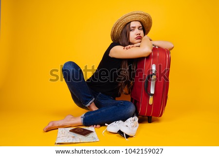 sad woman with a suitcase, independent travel