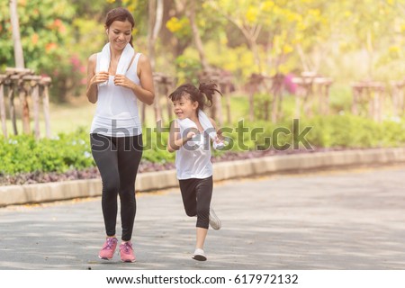 mother and her daughter running in the park, sports, healthy lifestyle