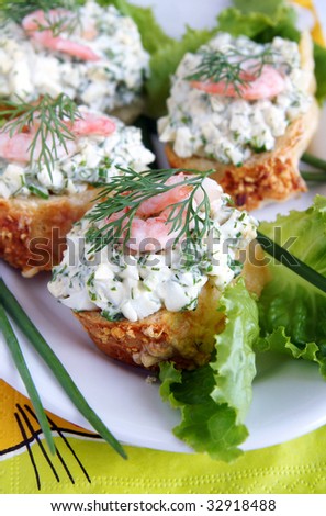 Healthy enrich sandwiches with shrimps, boiled eggs, green vegetables and herbs, blur background, vertical