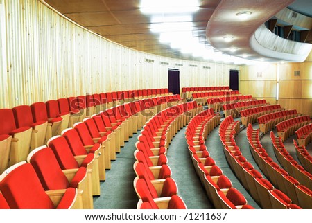hall for presentation, with red seats